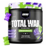 Red-Con1 Total War pre-workout powder container in Grape flavor with a black tub, purple and green label, and gummy candy graphics on a white background.