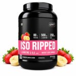 QNT ISO RIPPED Whey Protein Isolate, Strawberry Banana flavor protein powder in a black container with fresh strawberries and banana slices displayed beside the jar.