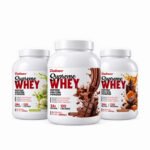 Three Dallaso Supreme Whey Protein tubs showing available flavors
